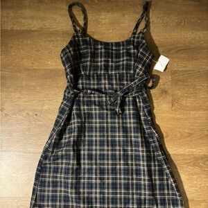 Black,Navy, and white plaid mini dress with tie back and straps